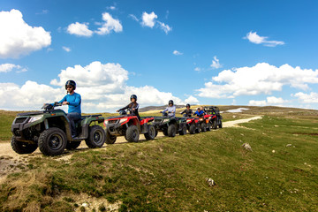 Friends driving off-road with quad bike or ATV and UTV vehicles © FS-Stock