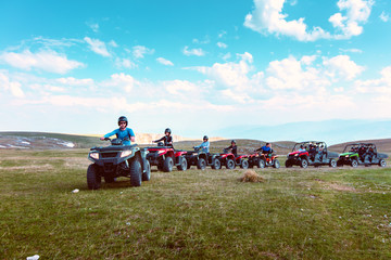 Friends driving off-road with quad bike or ATV and UTV vehicles © FS-Stock