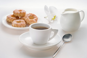 Early morning breakfast with coffee and pastry on a white background. Life style.