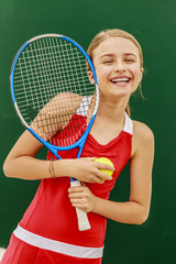 Tennis young girl player on court.