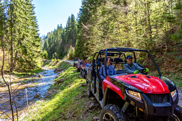 A tour group travels on ATVs and UTVs on the mountains © FS-Stock