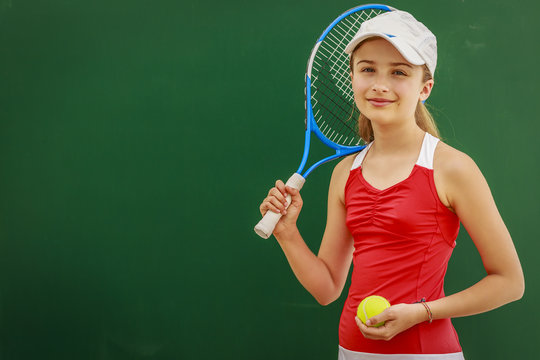 Tennis young girl player on court.