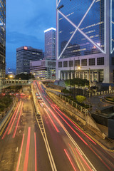 Fototapeta na wymiar Car Traffic in central district of Hong Kong city at dusk