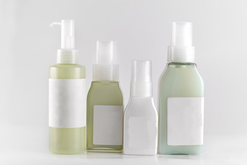 set of cosmetic bottles isolated on white background