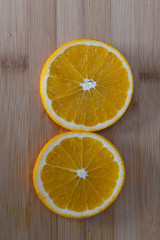 Fototapeta na wymiar Orange isolated in wooden background
