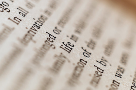 Word LIFE on a book paper
