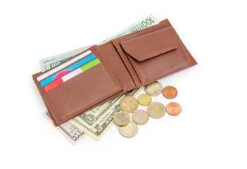 Money and bank cards in brown leather wallet and beside