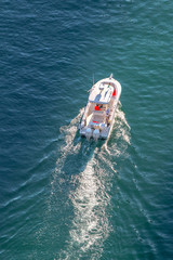 Speed boat at sea, view from above. Aerial view 