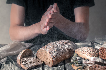 baker with flour in hand