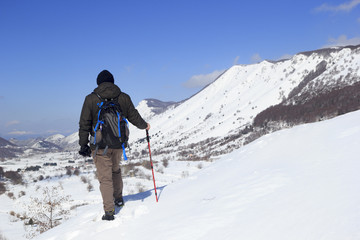 Fototapeta na wymiar hiker and valley in snow