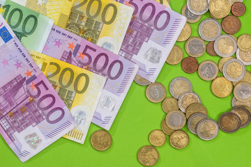 euro banknotes with coin, close up