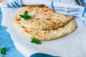 Indian flatbread - Herb stuffed paratha on a baking paper