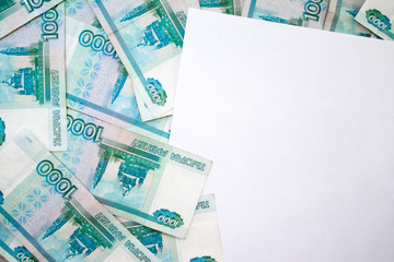 business, finance, saving, banking concept - close up bundle of money Russian Banknotes thousand rubles on wooden table