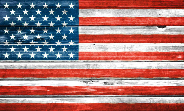 United States of America flag painted over wooden board. Closeup background