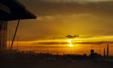 Colorful solar eclipse . Total solar eclipse over the city . 