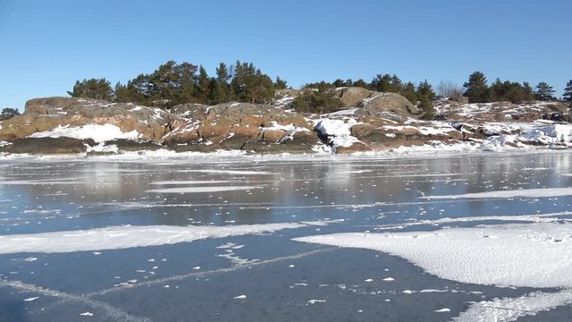 The coast of the frozen Gulf of Finland on a Sunny winter day. Hanko, Finland