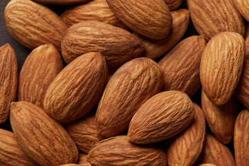 Close up of a pile of almonds as background.