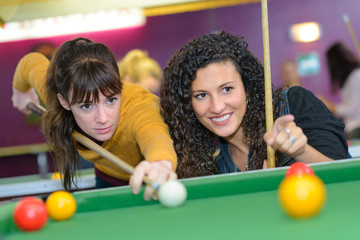 Fototapeta premium Women playing pool