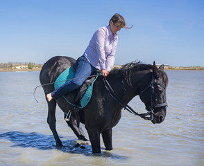 riding woman on the beach