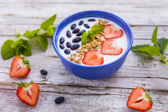 A delicious and healthy breakfast of yogurt with fresh fruit.
