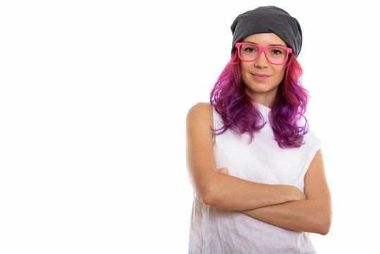 Studio shot of young beautiful woman wearing pink eyeglasses wit
