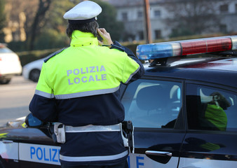 italian police car and policeman with the text POLIZIA LOCALE th