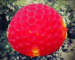 sphere made of colored plastic cups for the decoration of the ga