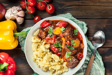 Hungarian beef goulash serwed with galuska noodles