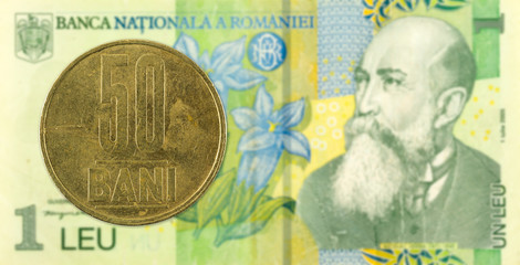 50 romanian bani coin against 1 romanian leu bank note