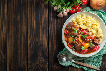 Hungarian beef goulash serwed with galuska noodles