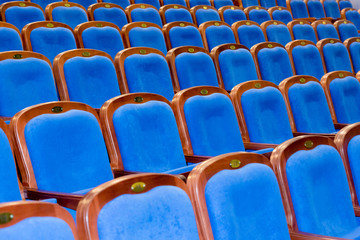 Blue brown wooden chairs in the auditorium. Without people