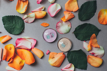 Grey background with colourful rose petals