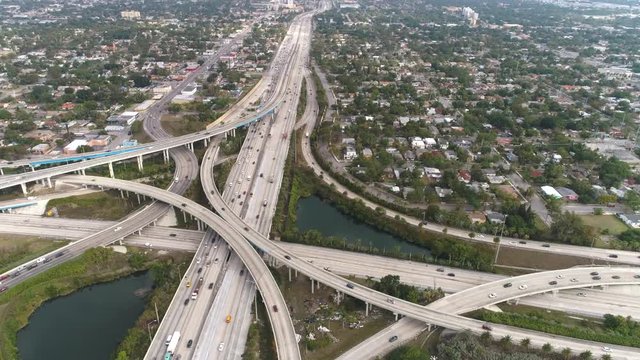 Aerial shot of highway intersection, I-95 and MacArthur Causeway. Aerial view of Miami freeway junction.
