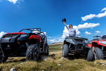Friends driving off-road with quad bike or ATV and UTV vehicles © FS-Stock