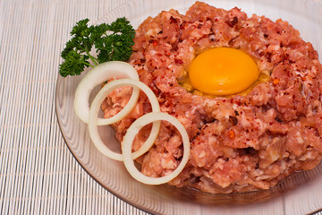 Minced meat. Ground meat with ingredients for cooking on a white background.
