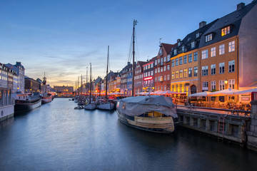 Nyhavn the waterfront canal at night in Copenhagen, Denmark