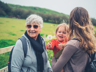 Grandmother with daughter and grandchild outdoors