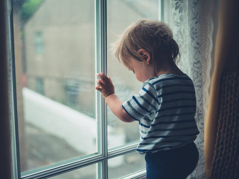 Little boy by window
