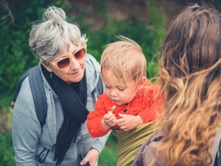 Grandmother with daughter and grandchild outdoors