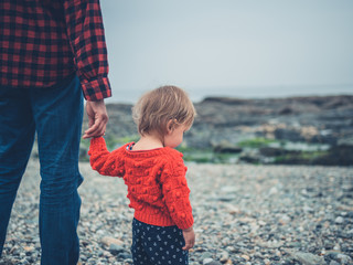 Father and son relaxing on the beach