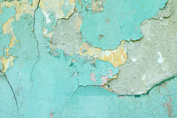 Naklejka premium Background concrete wall, traces of weathering, worn wall damaged paint old paint. Remains of old paint on the painted concrete surface. Grungy destruction surface.