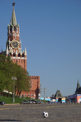 Fototapeta premium Moscow / Russia – 05.08.2018: image of a soccer ball on the Red Square in Moscow in front of the Spasskaya Tower of the Moscow Kremlin