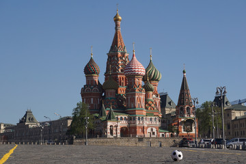 Fototapeta na wymiar Moscow / Russia – 05.08.2018: horizontal image of a soccer ball on the Red Square in Moscow in front of the Saint Basil's Cathedral, the ball on the right