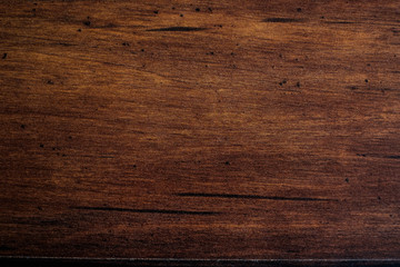 Brown scratched wooden cutting board. Wood texture. Wood background. 