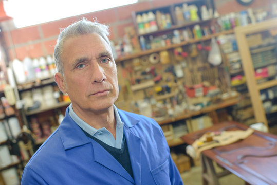 portrait of aged carpenter at work