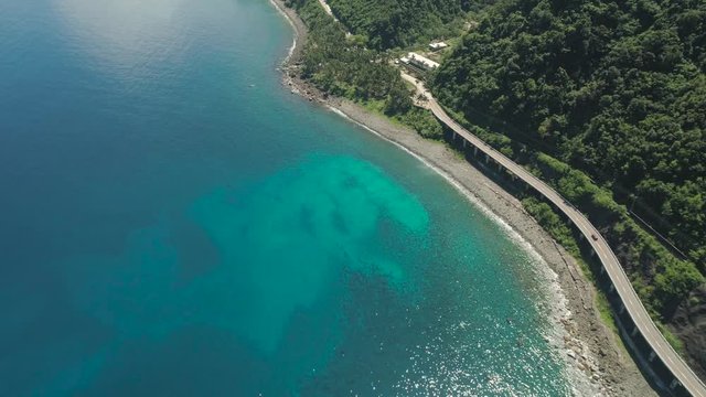 Aerial view of Patapat viaduct in the coast of Pagudpud, Ilocos Norte. Highway with bridge by coast sea near the mountains. Philippines, Luzon. Highway along the coast.