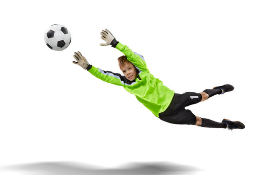 goalkeeper kid flying for the ball isolated on white