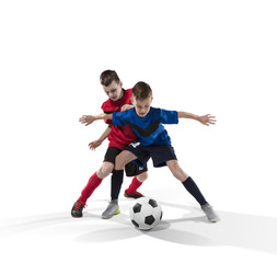 Fototapeta na wymiar two teenage fotball players struggling for the ball isolated on white