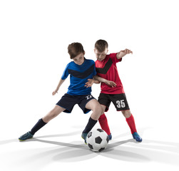 two teenage fotball players struggling for the ball isolated on white