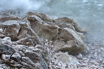 Seashore rocks in white mist